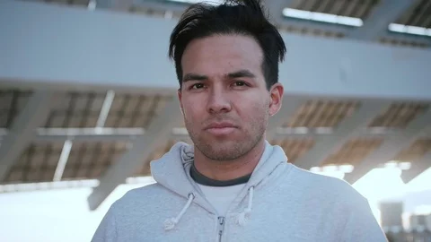 Portrait of young Hispanic man with a serious pensive look at the camera Stock Footage 105753529