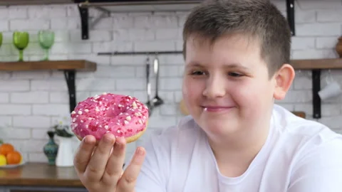 fat kid eating cupcake