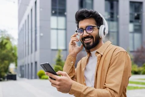 Portrait of a young indian programmer outside an office building on a work break Stock Photos