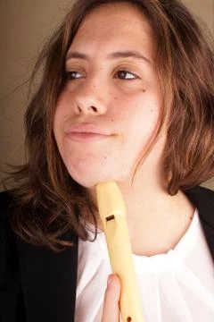 Portrait of a young lady with a flute Stock Photos