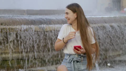 Portrait of young lady using her smartphone while traveling Video stock 225615425