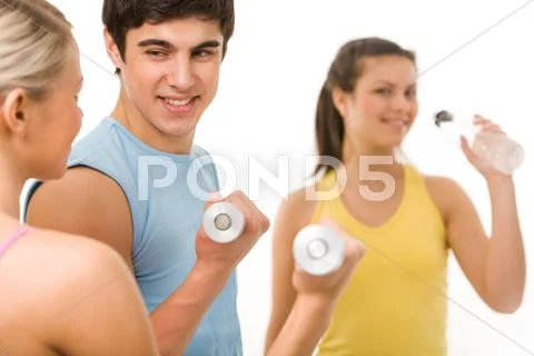 Portrait of young male instructor interacting with girl during physical training Stock Photos