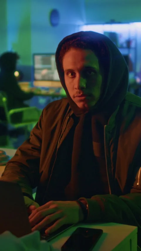 Portrait of Young Malicious Actor with Hood over Head during Night Shift Stock Footage 299230947