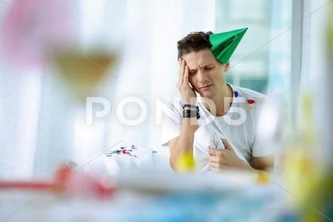 Portrait of young man with a bad head after party Stock Photos