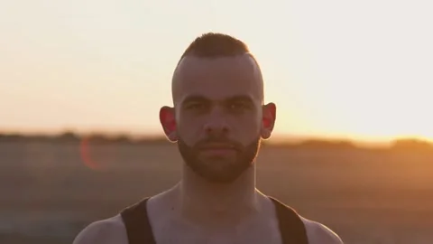 Portrait of young man with beard and short hair outdoors Stock Footage 132166408