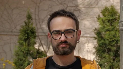 Portrait Of A Young Man With A beard And Glasses Stock Footage 238913747