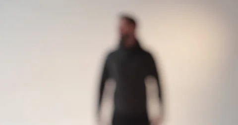Portrait of a young man with a beard in the studio. Stock Footage 253392352