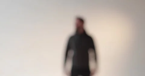 Portrait of a young man with a beard in the studio. Stock Footage 253392786