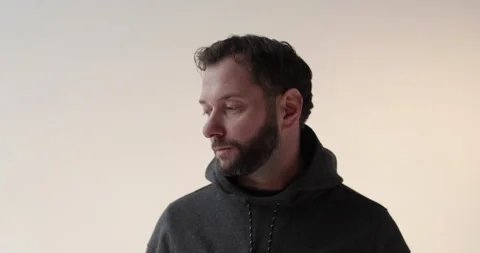 Portrait of a young man with a beard in the studio. Stock Footage 253394037