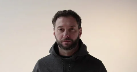 Portrait of a young man with a beard in the studio. Stock Footage 253394345