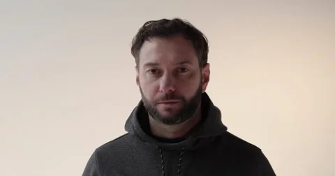 Portrait of a young man with a beard in the studio. Stock Footage 253395080