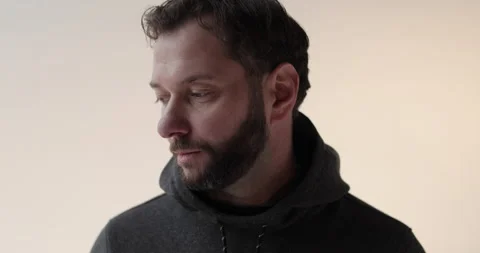 Portrait of a young man with a beard in the studio. Stock Footage 253395131