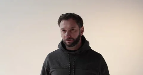 Portrait of a young man with a beard in the studio. Stock Footage 253395333