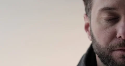 Portrait of a young man with a beard in the studio. Stock Footage 253395999