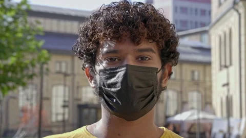Portrait of young man with black protective face mask. Stock Footage 163280674