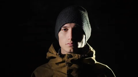 Portrait of a young man in contrast light 動画素材 121466089