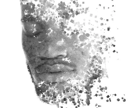 A portrait of a young man dissolving into countless particles. Stock-Fotos