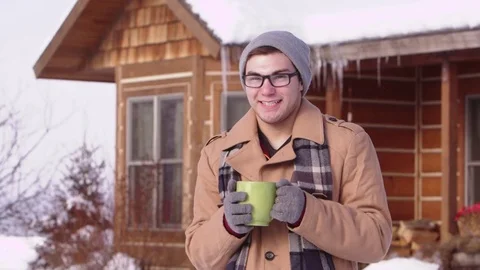 Portrait of young man drinking form hot mug Stock-Footage 80128395