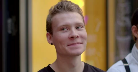 Portrait young man guy student smiling close-up face. Lifestyle embarrassed boy Stock Footage 248864491