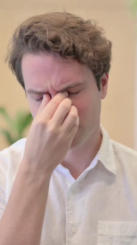 Portrait of Young Man having Headache, Vertical Video Stock Footage 340033633
