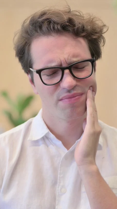 Portrait of Young Man having Toothache, Cavity , Vertical Video Stock Footage 340033831