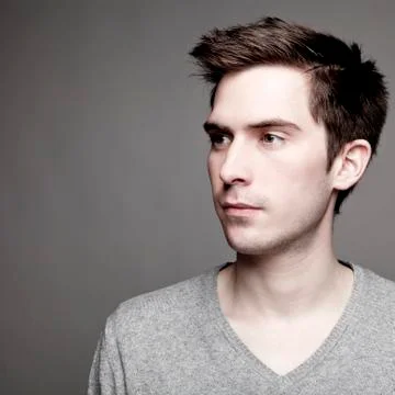 Portrait of young man looking away, close-up Stock Photos