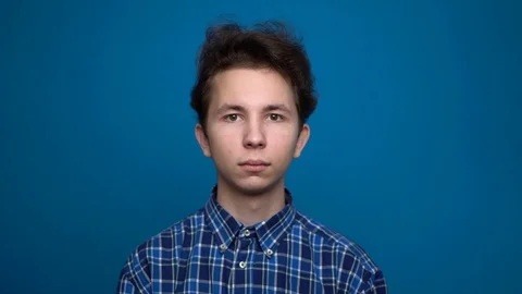 Portrait young man looking into camera Stock Footage 126723268