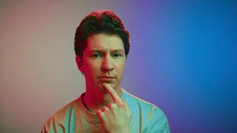 Portrait of Young Man Looking at Camera with Thinking Face Considering Thoughts 스톡 동영상 259613626