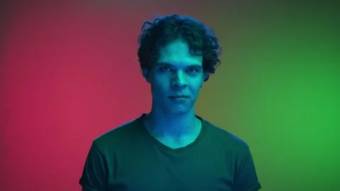 Portrait of Young Man Looking at Camera and Shaking Head in Agreement to Speaker Stock Footage 265052586