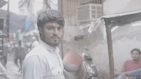 Portrait of a young man looking at the camera in Mumbai, India Stock Footage 345389478