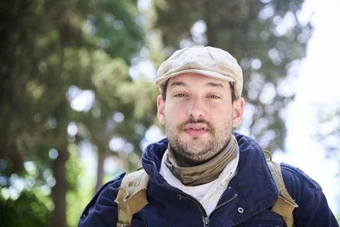Portrait of a young man looking at the camera, outdoors. Stock Photos