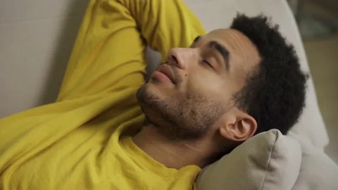 Portrait of a young man lying on a couch. Stock Footage 163158211