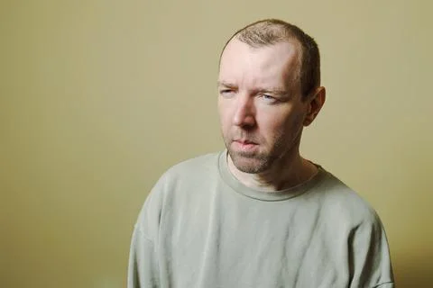 Portrait of a young man making faces. The man looks in disbelief Foto stock