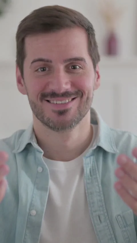 Portrait of Young Man Pointing at the Camera and Inviting, Vertical Video 스톡 동영상 328968530