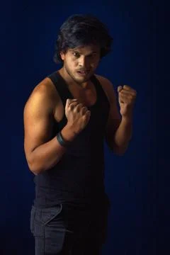 Portrait of a young man posing and showing his muscular body. The concept o.. Stock Photos