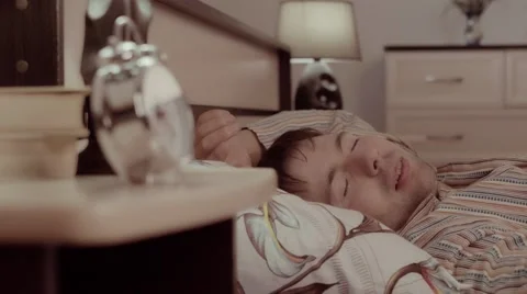 Portrait of young man sleeping in bed alone and having trouble to fall soundly Stock-Footage 68421473