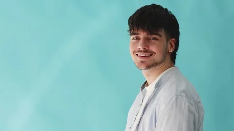 Portrait of young man smiling isolated on background looking at camera Stock Footage 254014564
