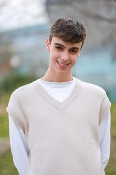 Portrait of a young man smiling while standing outdoors. Foto stock