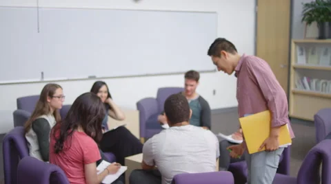 Portrait of a young man standing in front of his classmates Stock Footage 55123851