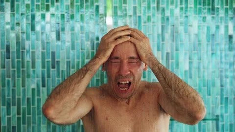 Portrait Of Young Man Taking Cold Shower Stock Footage 221234317