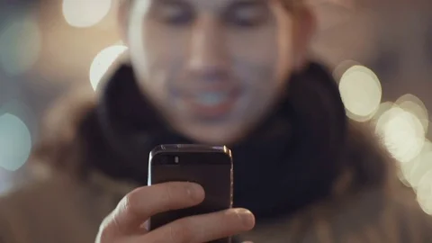 Portrait of young man using his mobile phone at night. Stock Footage 71222203
