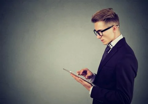 Portrait of a young man using a tablet pc Stock Photos