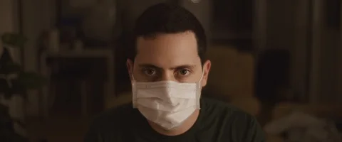 Portrait of a young man wearing a protective mask, close up Stock Footage 126341352