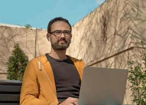 Portrait Of A Young Man WithUsing His Laptop Stock Photos