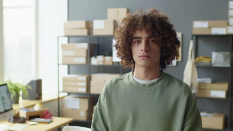Portrait of Young Man at Work in Delivery Service Office Stock Footage 228481446