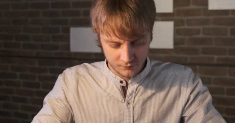 Portrait Of Young Man at Work, Leather Craftsman Sew Purse, Home Workshop Stock Footage 133009489