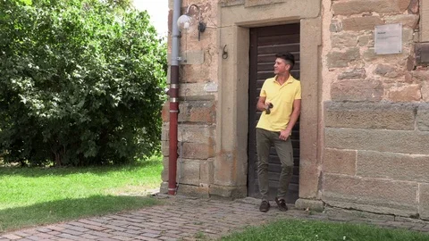 Portrait of a young man in a yellow t-shirt 動画素材 112370191