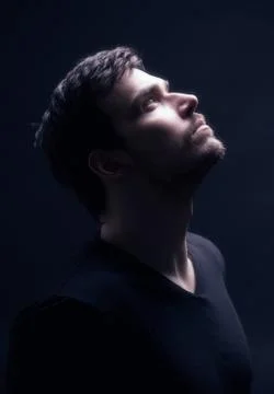 Portrait of a young men looking up. Stock Photos