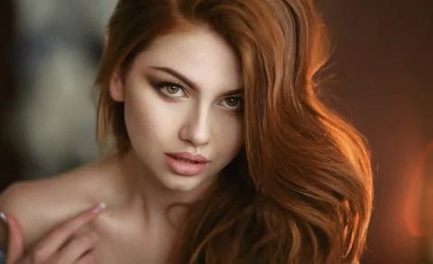 Portrait of a young model close up with red hair Stock Photos