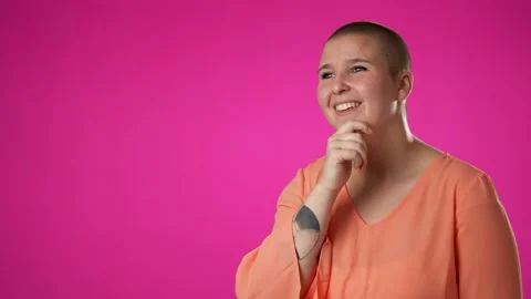 Portrait of young non binary gender fluid woman 20s remember great memories Video stock 223261622